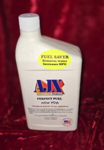 Fuel additive bottle on red background.